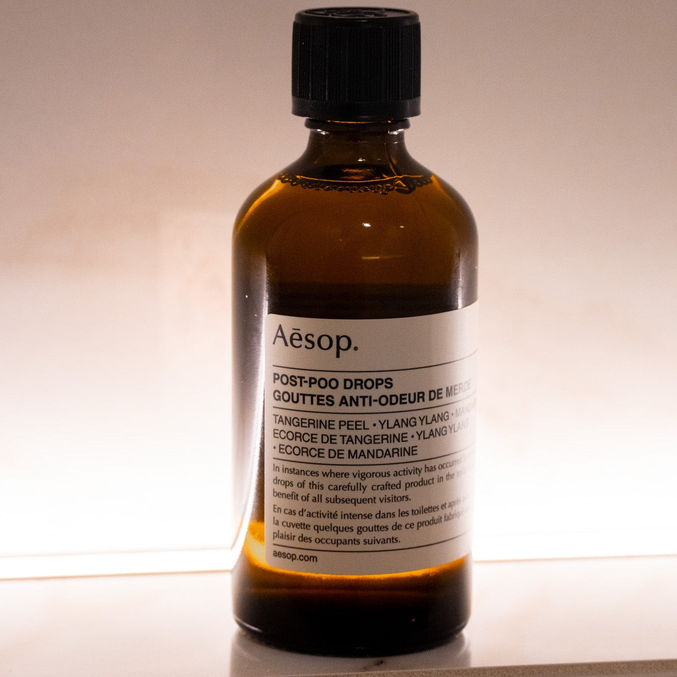 Aesop bottle on a neutral background